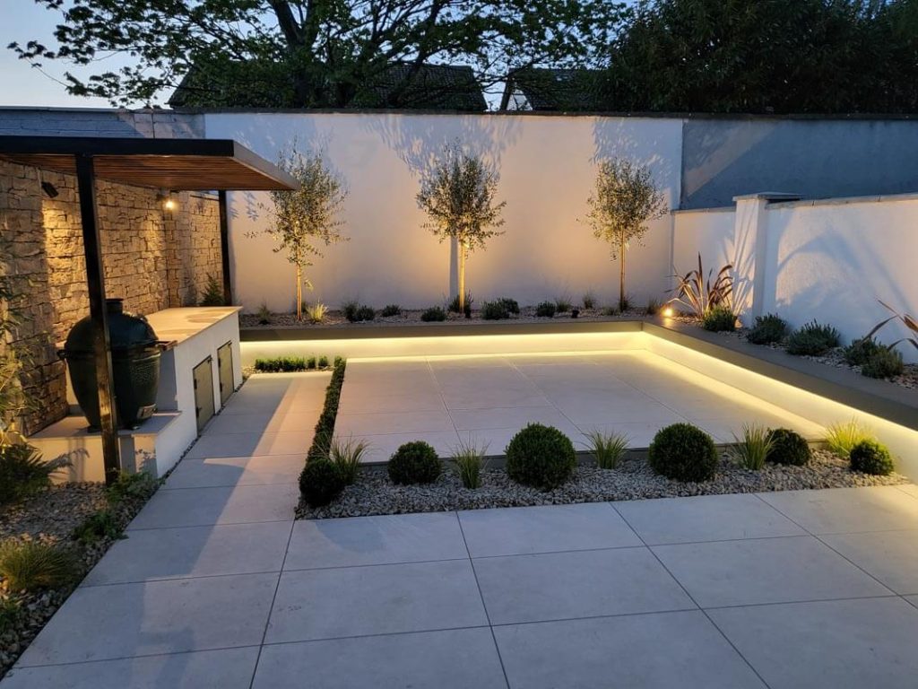 Glasnevin garden lighting and feature stone wall at dusk